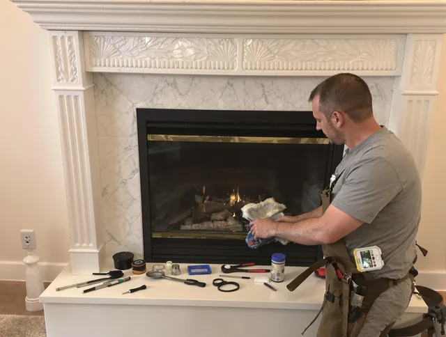 Scituate Chimney Sweep performing fireplace maintenance in Scituate, RI